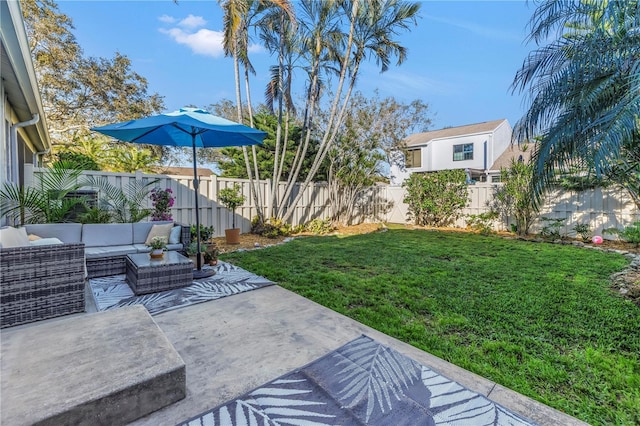 view of yard with a patio area, a fenced backyard, and an outdoor living space