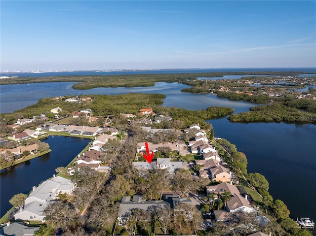 drone / aerial view with a residential view and a water view