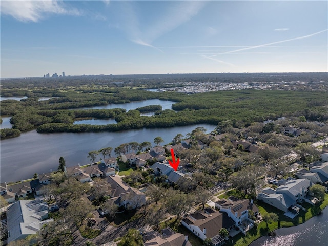 drone / aerial view with a residential view and a water view