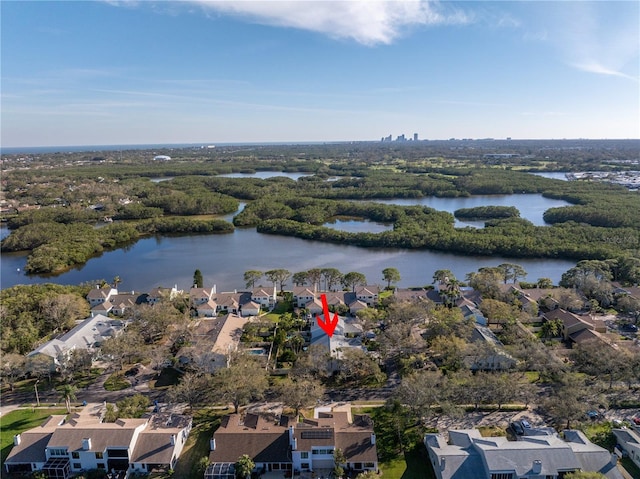 drone / aerial view with a water view and a residential view