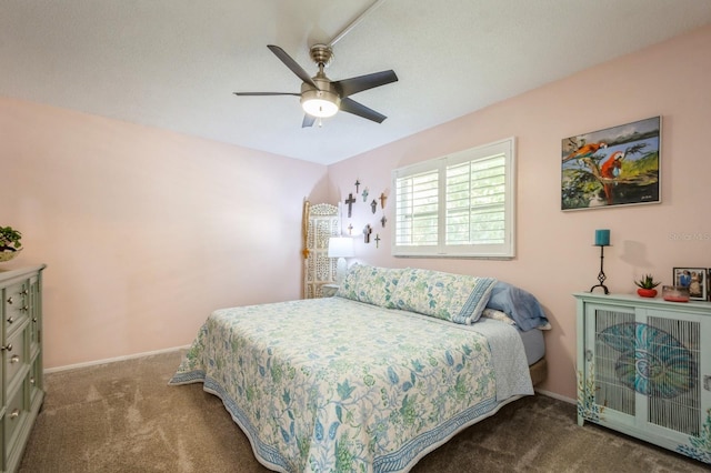 bedroom featuring ceiling fan, carpet flooring, and baseboards