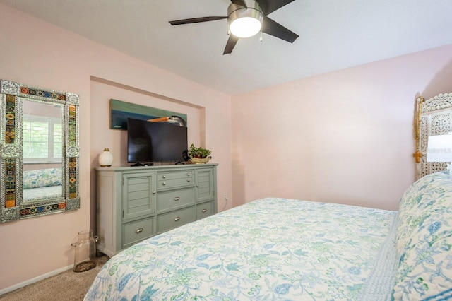 bedroom with carpet floors, ceiling fan, and baseboards