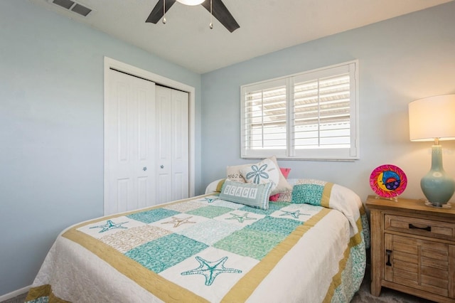 bedroom with a ceiling fan, visible vents, and a closet