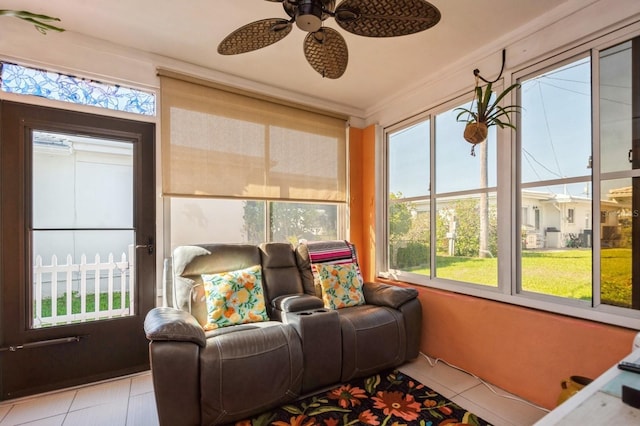 sunroom / solarium featuring ceiling fan