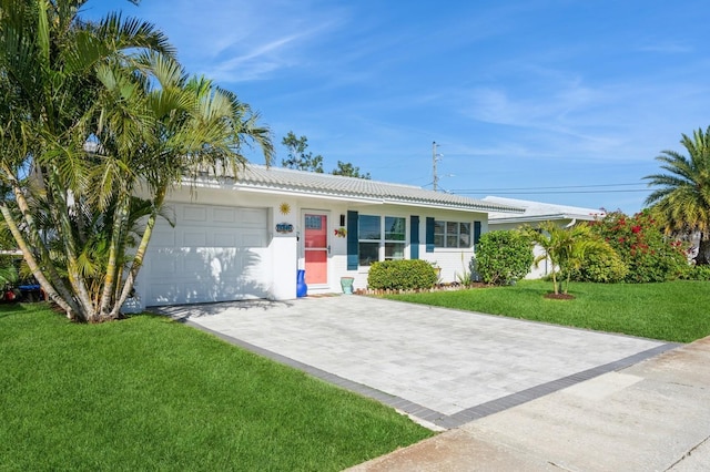 ranch-style home featuring a garage, a tile roof, decorative driveway, a front yard, and stucco siding