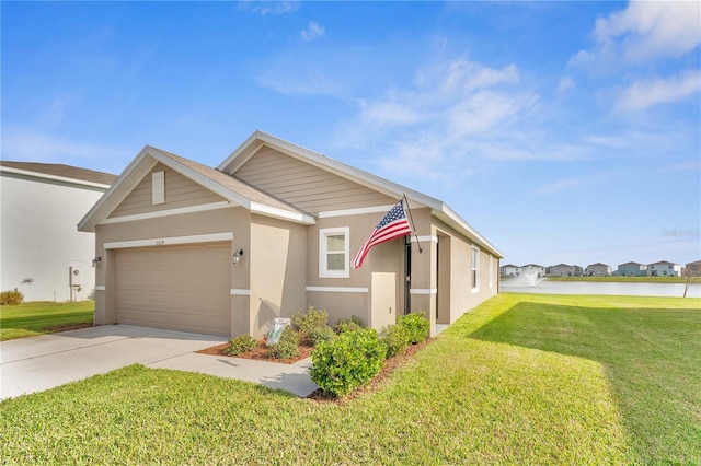 view of front of property with stucco siding, a front yard, concrete driveway, and an attached garage