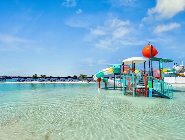 communal playground featuring a water view