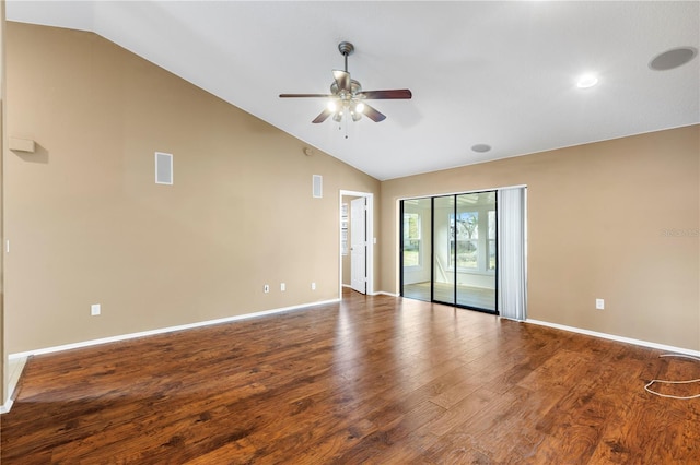 empty room with lofted ceiling, visible vents, a ceiling fan, wood finished floors, and baseboards