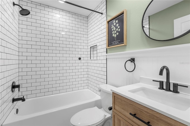 bathroom with toilet, vanity, tub / shower combination, and wainscoting