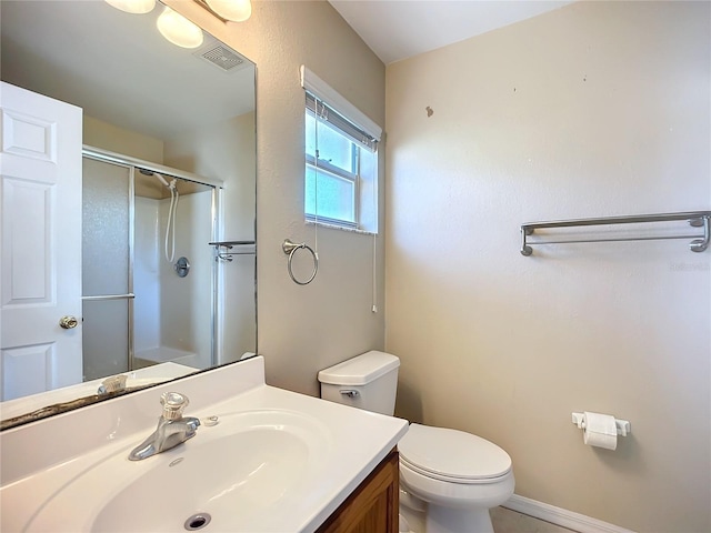 full bath with a stall shower, baseboards, visible vents, toilet, and vanity