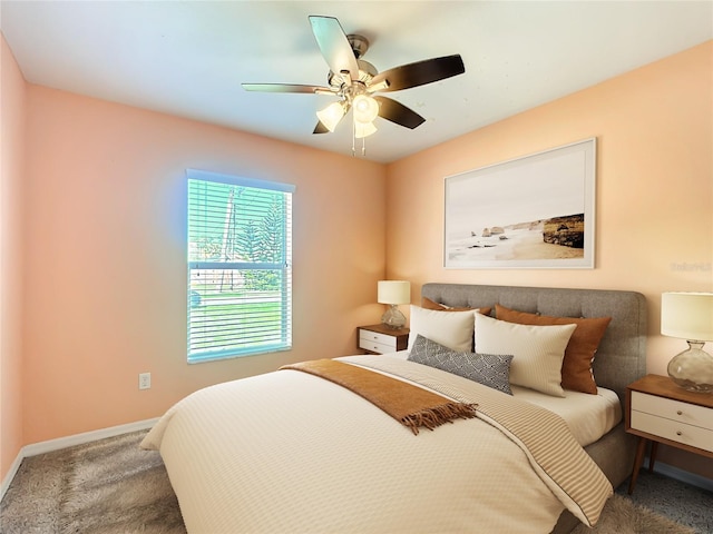 bedroom with carpet, baseboards, and a ceiling fan