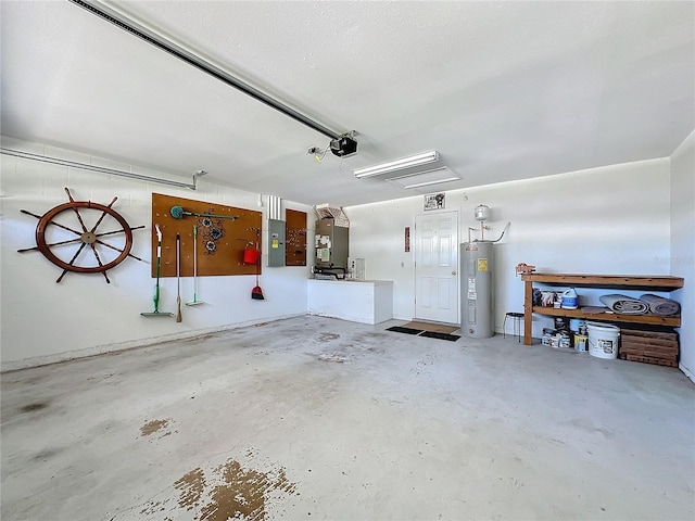 garage featuring electric panel and water heater