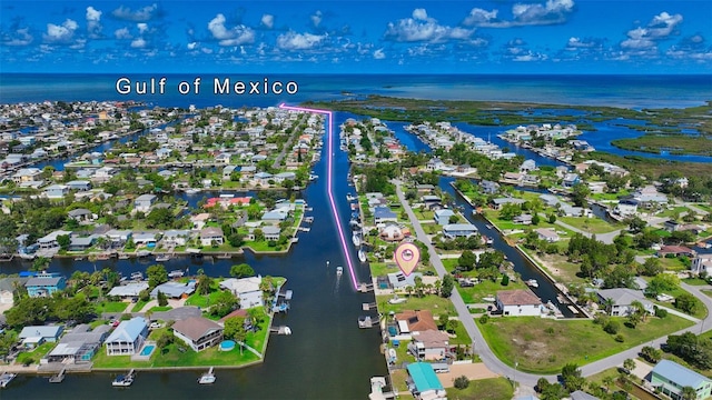 drone / aerial view with a water view and a residential view