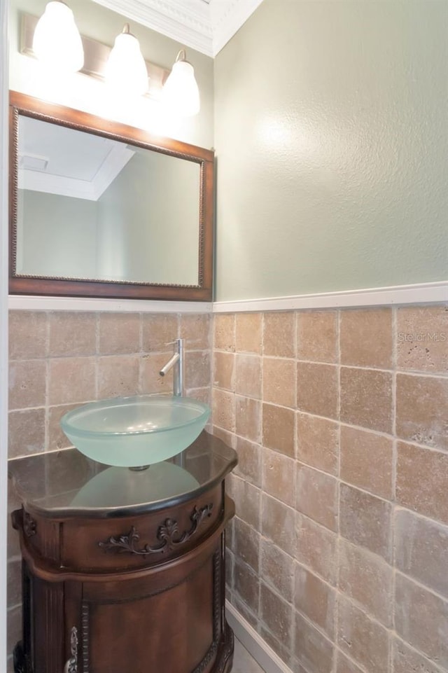 bathroom featuring tile walls and vanity