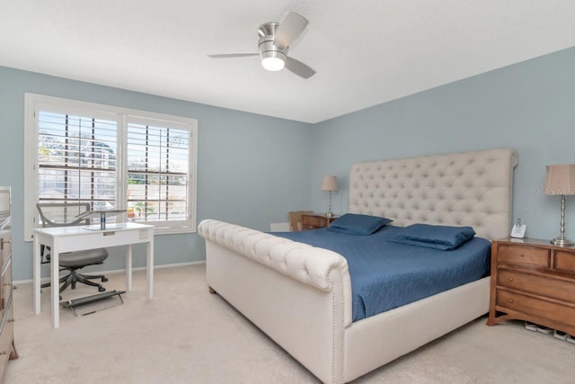 bedroom with carpet floors, baseboards, and a ceiling fan