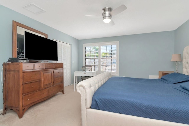 bedroom with light colored carpet, visible vents, and ceiling fan