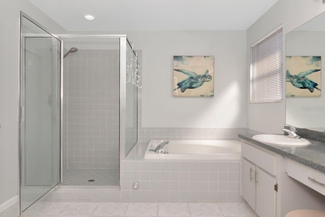 full bath featuring a stall shower, vanity, a bath, and tile patterned floors