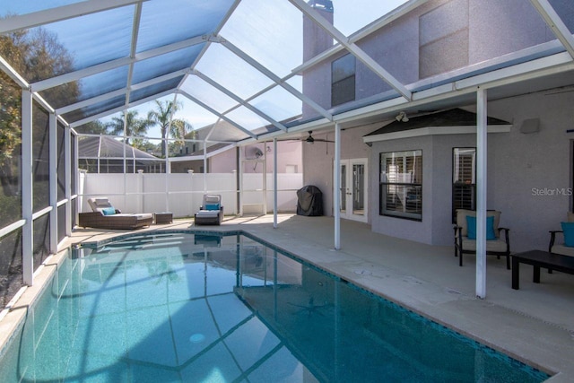 view of swimming pool featuring a patio, french doors, glass enclosure, and a fenced in pool