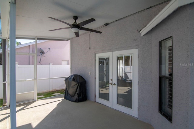 view of patio / terrace featuring a ceiling fan, french doors, a grill, and fence