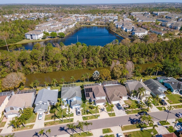 drone / aerial view featuring a water view and a residential view