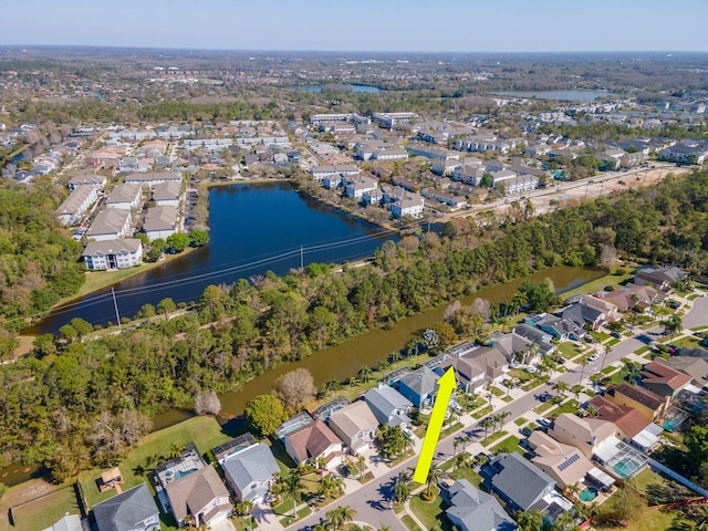 birds eye view of property featuring a residential view and a water view