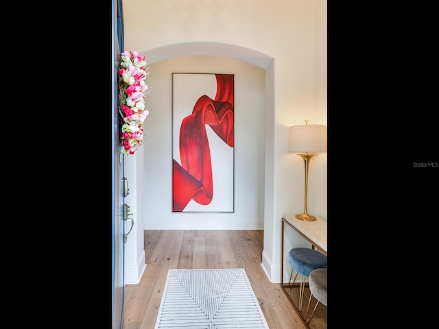 interior space featuring baseboards and wood finished floors