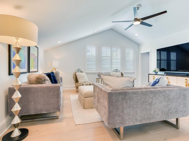 living room with lofted ceiling, light wood finished floors, ceiling fan, and recessed lighting