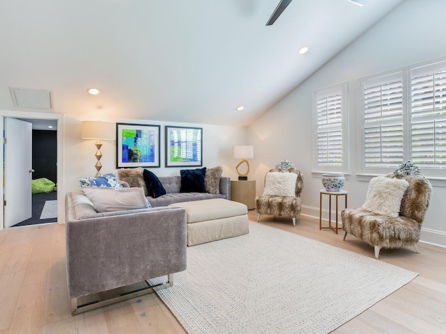 living area with ceiling fan, recessed lighting, vaulted ceiling, and wood finished floors