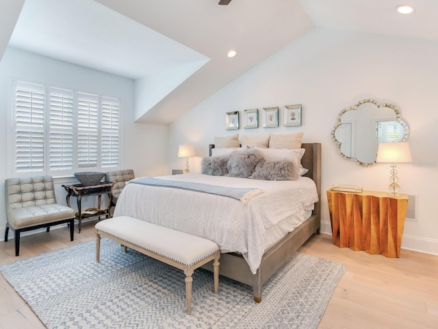 bedroom featuring light wood-type flooring, vaulted ceiling, baseboards, and recessed lighting