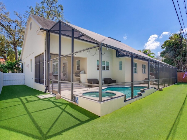 back of property featuring a yard, a lanai, a fenced backyard, and a patio