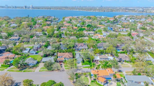 drone / aerial view featuring a water view and a residential view