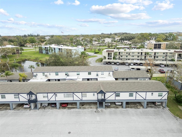 birds eye view of property featuring a water view and a residential view