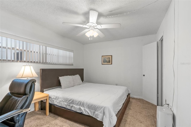 bedroom with light carpet, a textured ceiling, and a ceiling fan