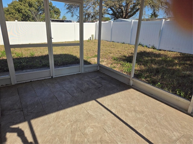 unfurnished sunroom featuring a healthy amount of sunlight