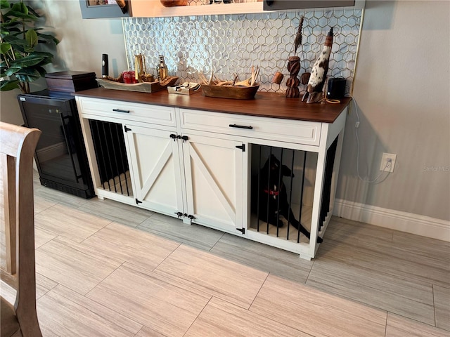 bar with a bar and baseboards