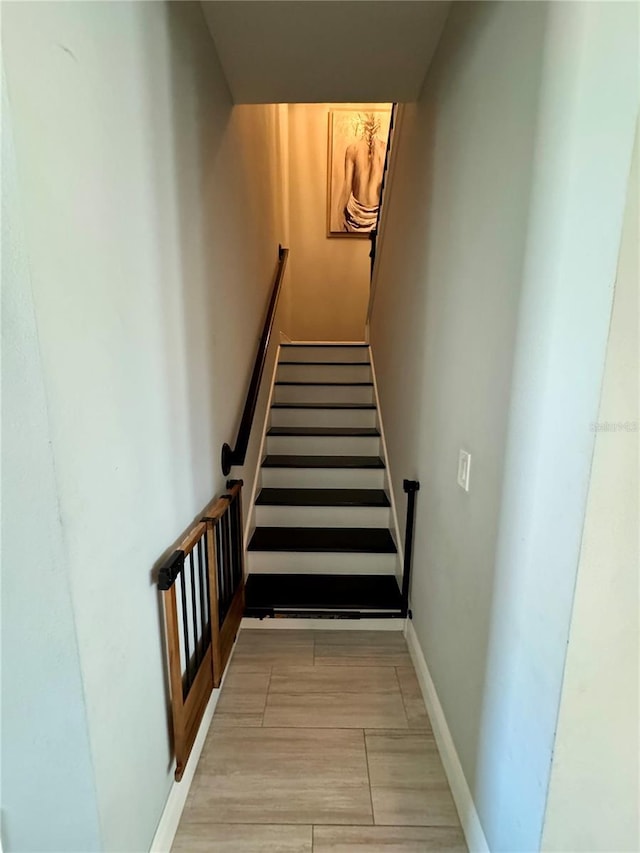 staircase with baseboards