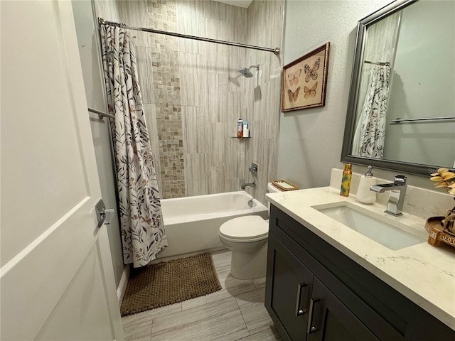 bathroom with vanity, shower / bath combo with shower curtain, and toilet