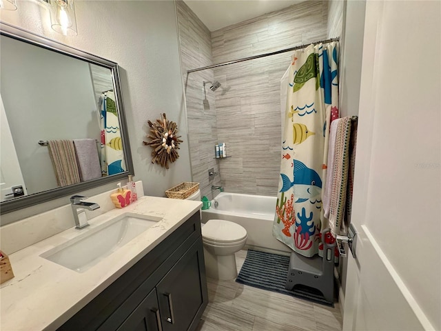 bathroom featuring toilet, shower / bath combination with curtain, and vanity