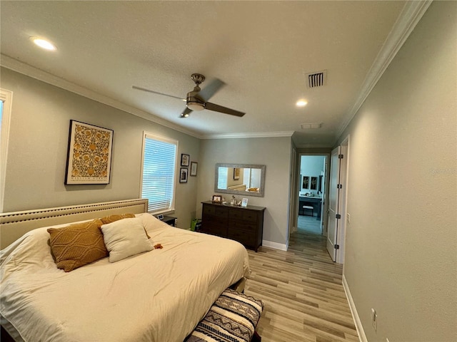 bedroom with crown molding, visible vents, light wood-style floors, ceiling fan, and baseboards