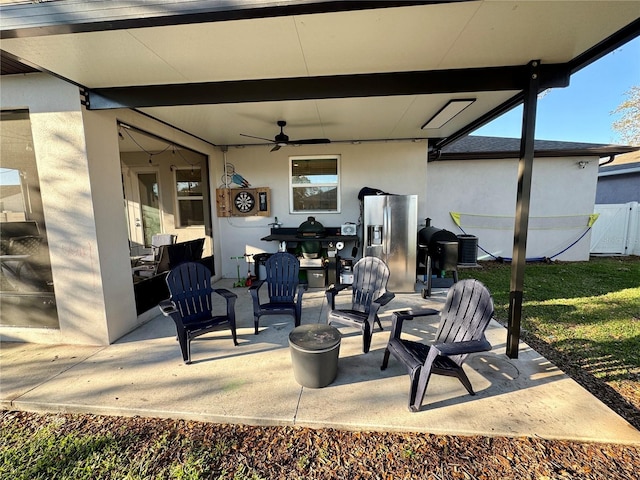 view of patio / terrace featuring a ceiling fan and fence