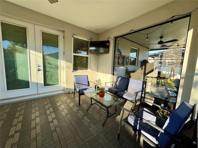 view of patio / terrace with french doors and a ceiling fan