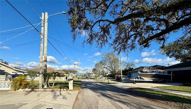 view of street featuring curbs and street lights