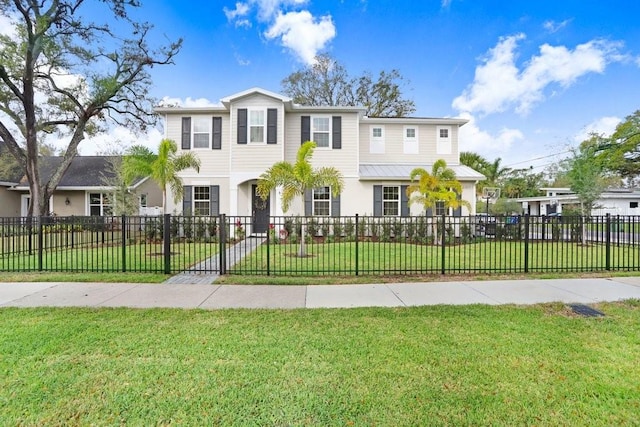 view of front facade with a fenced front yard and a front yard