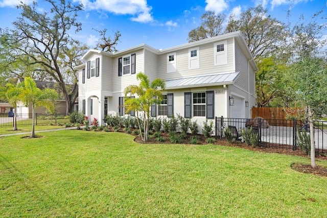 view of front of property with metal roof, an attached garage, fence, a standing seam roof, and a front yard