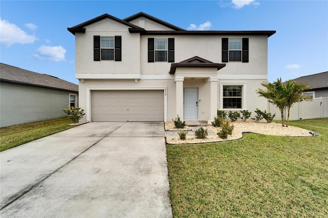 view of front of house featuring driveway, a garage, stucco siding, fence, and a front yard