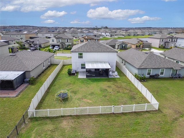 birds eye view of property with a residential view