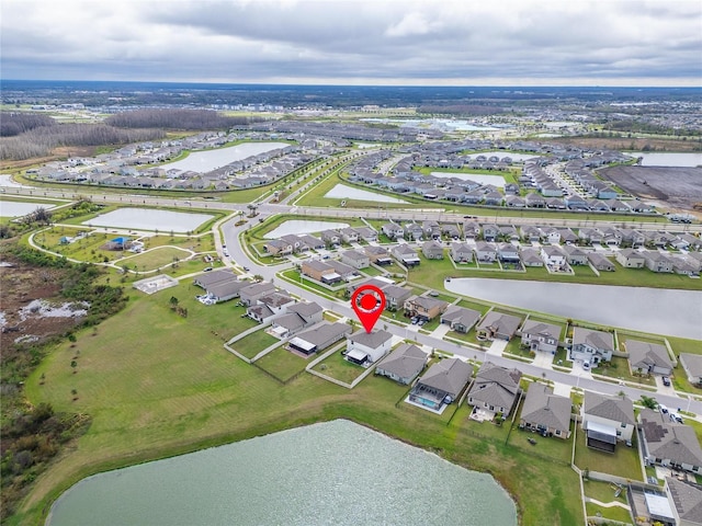 bird's eye view featuring a water view and a residential view