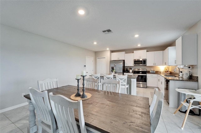 dining room featuring recessed lighting, visible vents, baseboards, and light tile patterned flooring