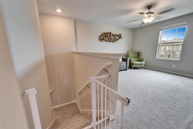 interior space with recessed lighting, baseboards, carpet flooring, and an upstairs landing