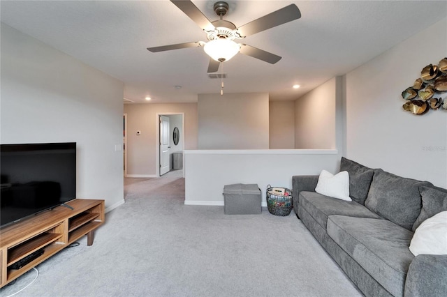 carpeted living area featuring baseboards, visible vents, a ceiling fan, and recessed lighting